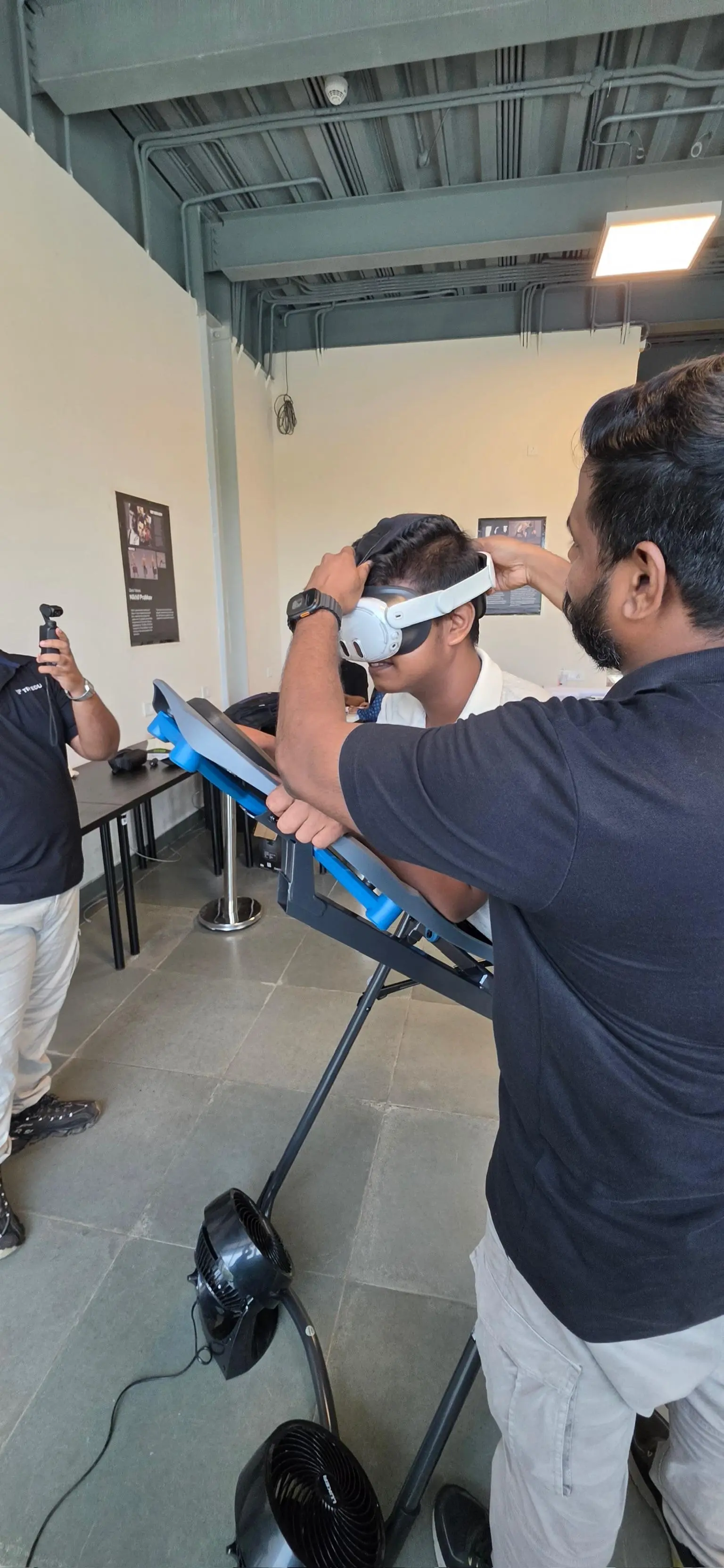 Guest on the SkyDrop VR Bungee rig while the headset is adjusted